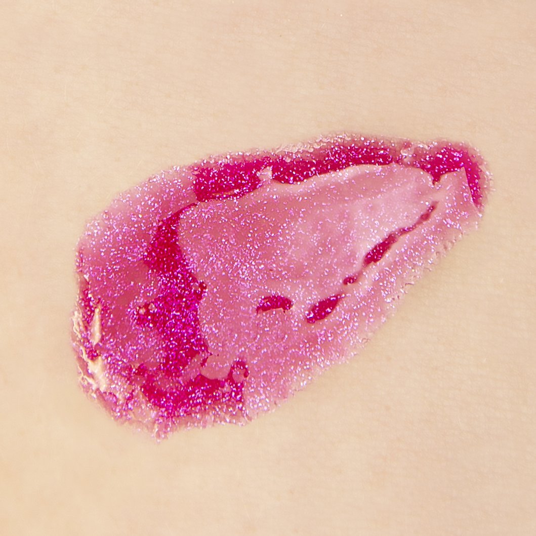 theBalm cosmetics PLUMP YOUR PUCKER® Lip Gloss Magnify - sheer magenta glitter